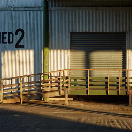  Outside by the main entry to Shed 2
